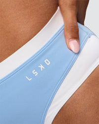 Woman wearing Turbo Track Brief in Open Air-White | Model:Txai | Size:XS | Thumbnail Index: 2
