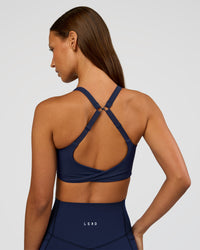 Woman wearing Twist Sports Bra D/DD/E - Future Navy | Model:Brylee | Size:XS | Thumbnail Index: 0