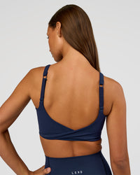 Woman wearing Twist Sports Bra D/DD/E - Future Navy | Model:Brylee | Size:XS