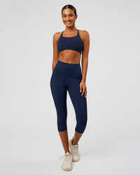 Woman wearing Twist Sports Bra - Future Navy | Model:Charli | Size:XS