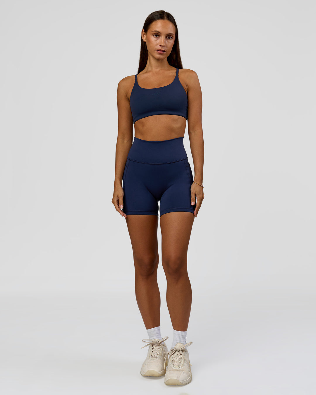 Woman wearing Twist Sports Bra - Future Navy | Model:Brylee | Size:XS