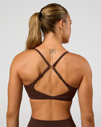 Woman wearing Twist Sports Bra - Hot Chocolate | Model:Maja | Size:XS