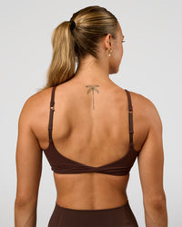 Woman wearing Twist Sports Bra - Hot Chocolate | Model:Maja | Size:XS