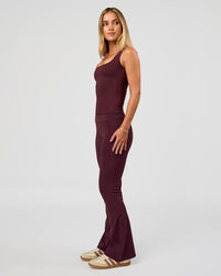 Woman wearing Twist Square Neck Shelf Bra Tank in Cherry Lacquer | Model:Issy | Size:XS