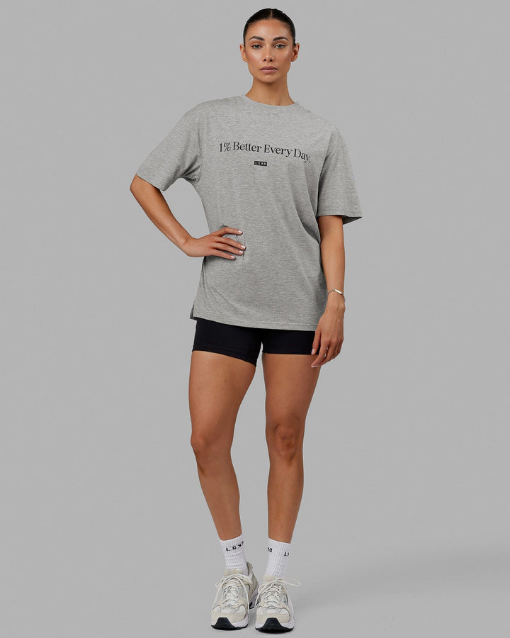 Woman  wearing Unisex 1% Better FLXCotton Tee Oversize - Lt Grey Marl-Black