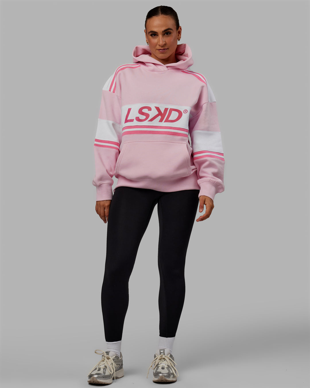 Woman wearing Unisex A-Team Hoodie Oversize - Petal Pink-White