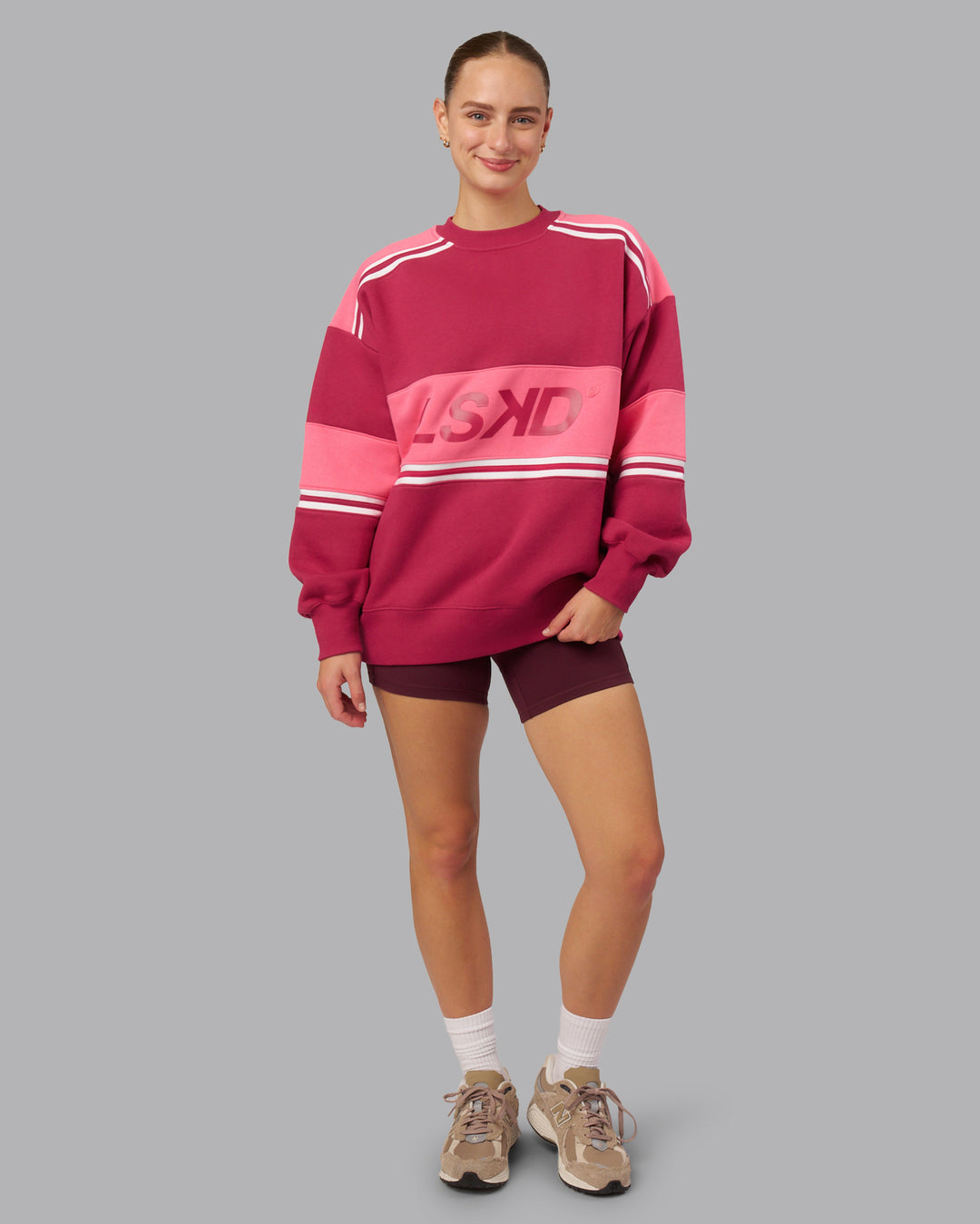 Woman wearing A-Team Sweater Oversize - Vivacious-Hot Pink | Model:Lillie | Size:XS