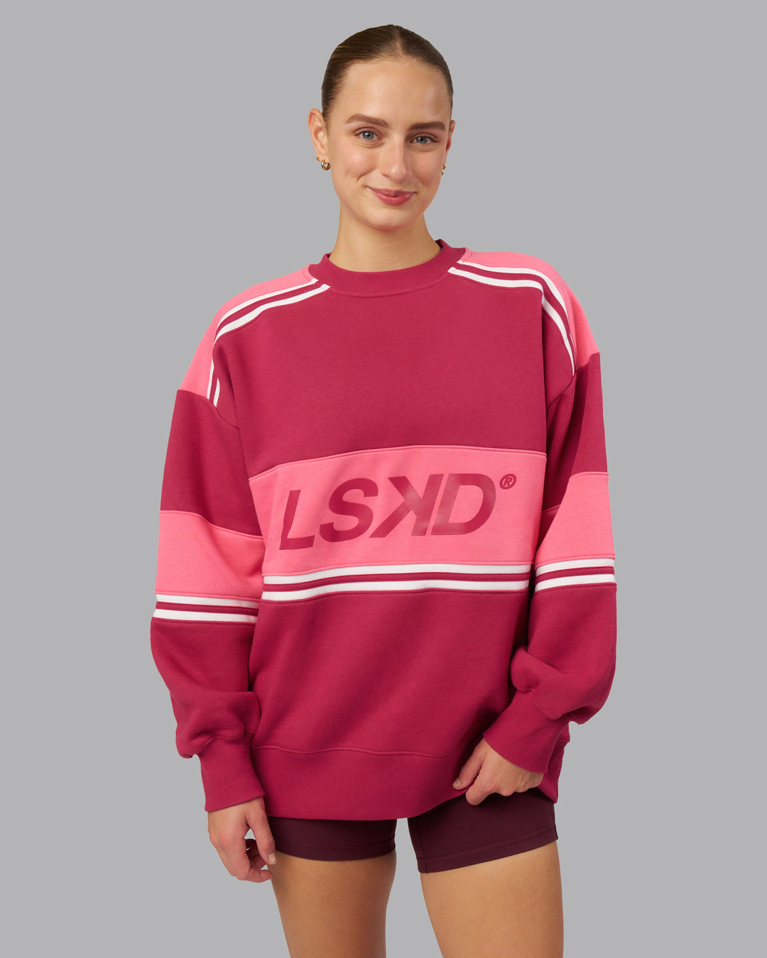Woman wearing A-Team Sweater Oversize - Vivacious-Hot Pink | Model:Lillie | Size:XS