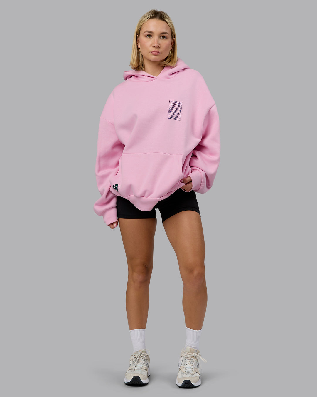 Woman wearing Displacement Oversized Hoodie - Light Bubblegum-Dark Moss | Model:Halle | Size:XS