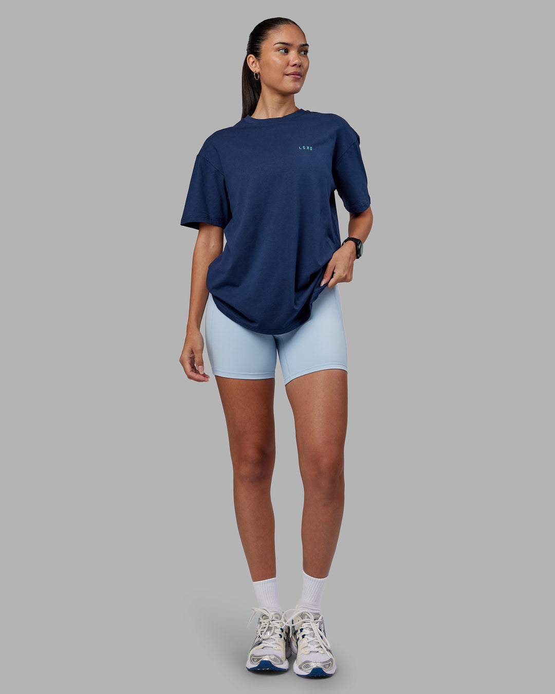Woman wearing Enjoy the Journey Value Series FLXCotton Tee Oversize - Future Navy-Blue Atoll | Model:Rhiley | Size:XS