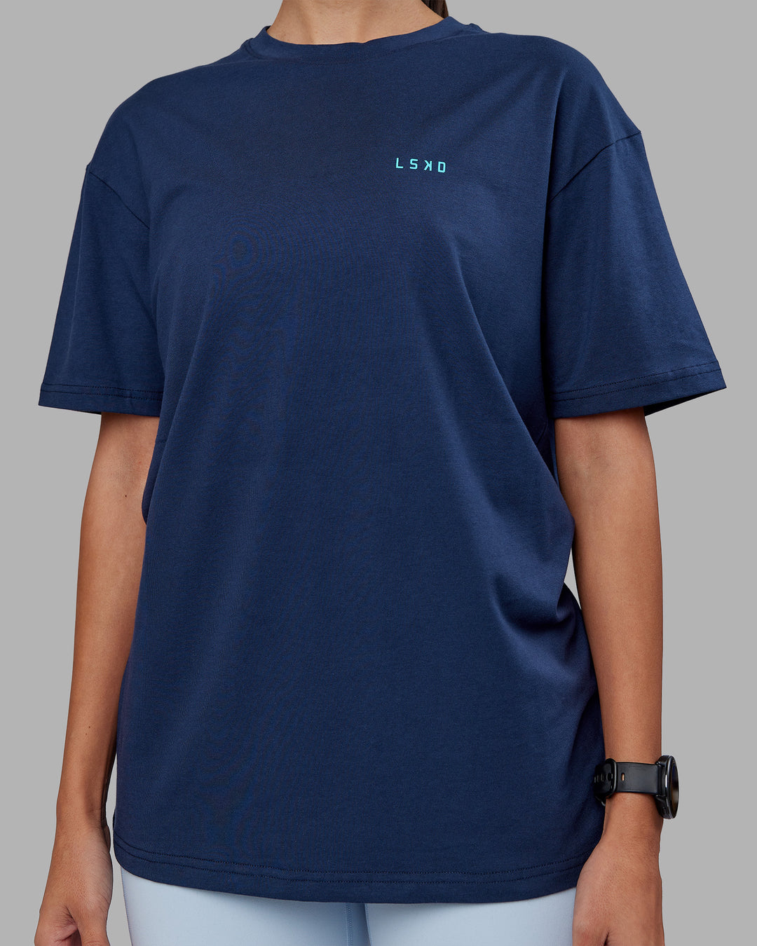 Woman wearing Enjoy the Journey Value Series FLXCotton Tee Oversize - Future Navy-Blue Atoll | Model:Rhiley | Size:XS