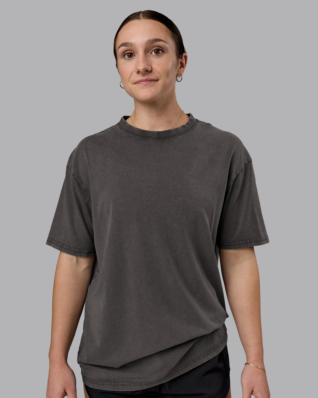 Woman wearing Heart FLXCotton Oversized Tee - Washed Dark Storm-Violet Ray | Model:Sav | Size:XS