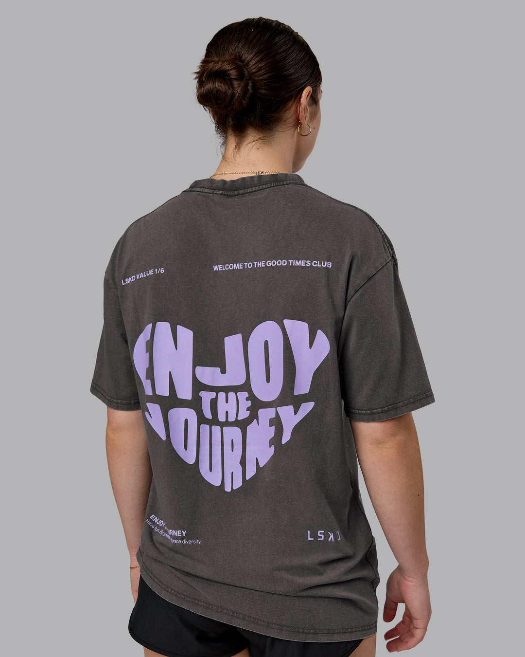 Woman wearing Heart FLXCotton Oversized Tee - Washed Dark Storm-Violet Ray | Model:Sav | Size:XS