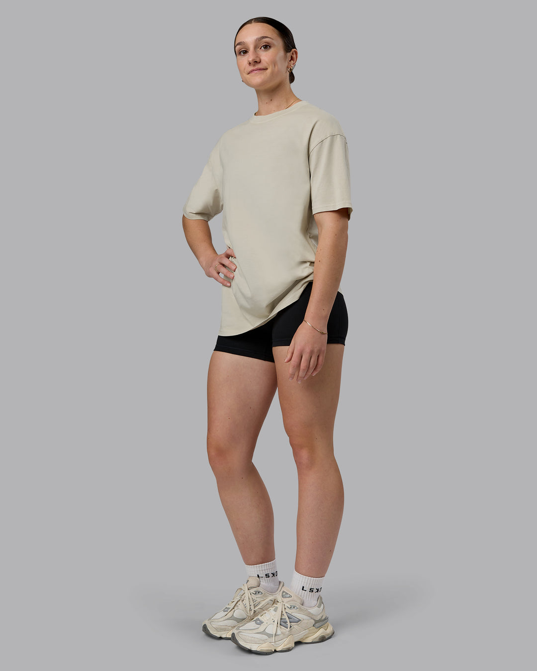 Woman wearing Heart FLXCotton Oversized Tee - Washed Shale Beige-White | Model:Sav | Size:XS