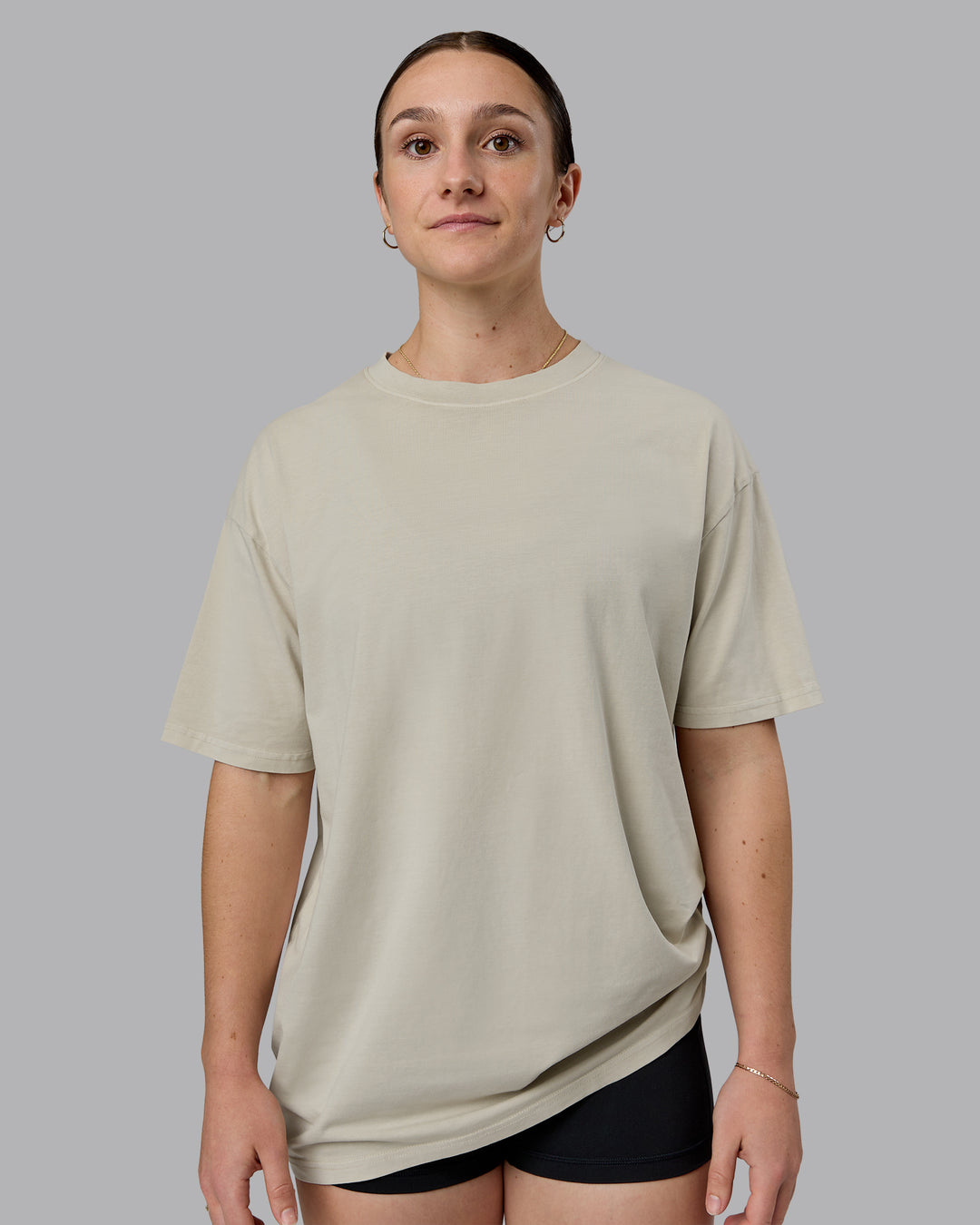 Woman wearing Heart FLXCotton Oversized Tee - Washed Shale Beige-White | Model:Sav | Size:XS