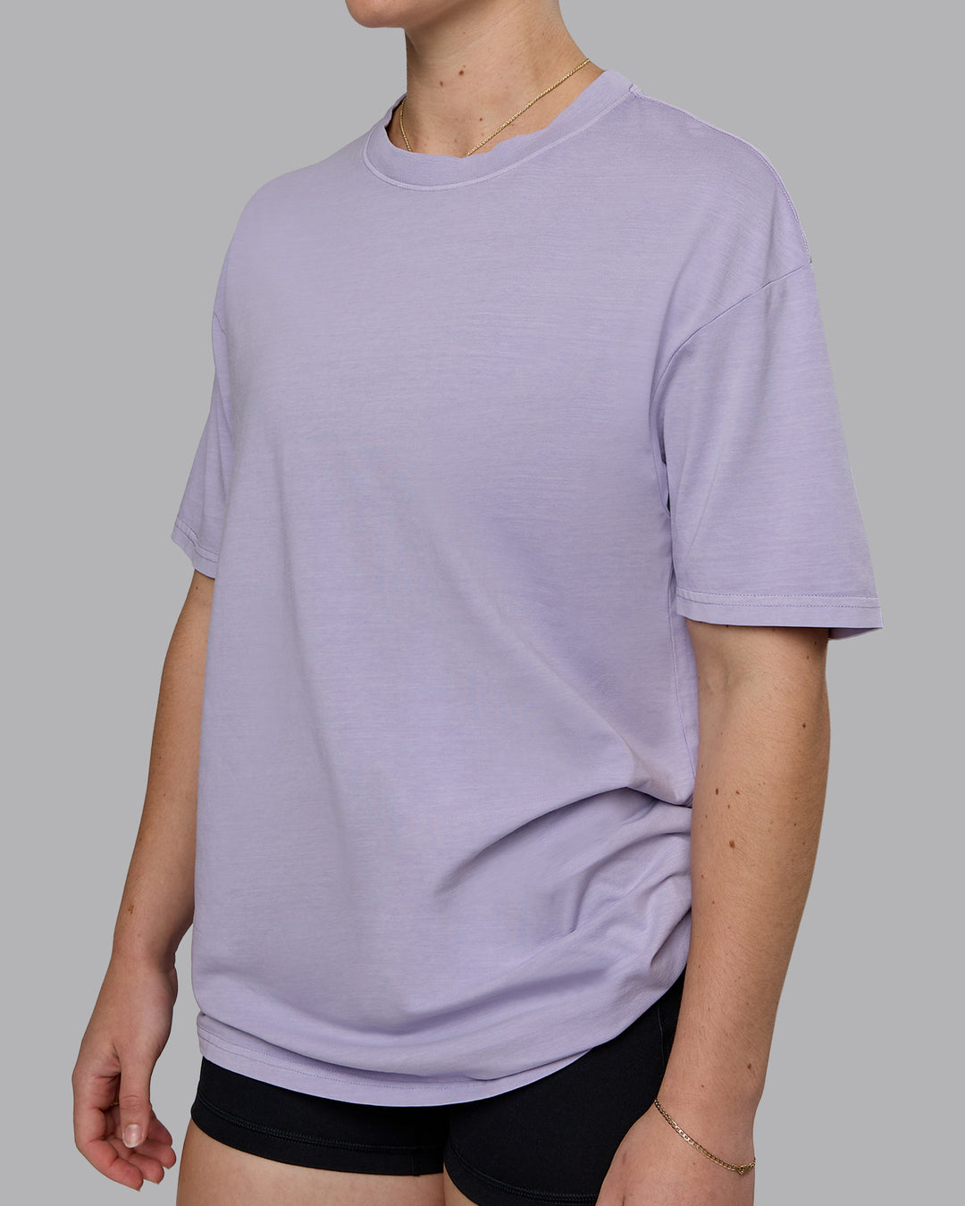 Woman wearing Heart FLXCotton Oversized Tee - Washed Violet Ray-White | Model:Sav | Size:XS