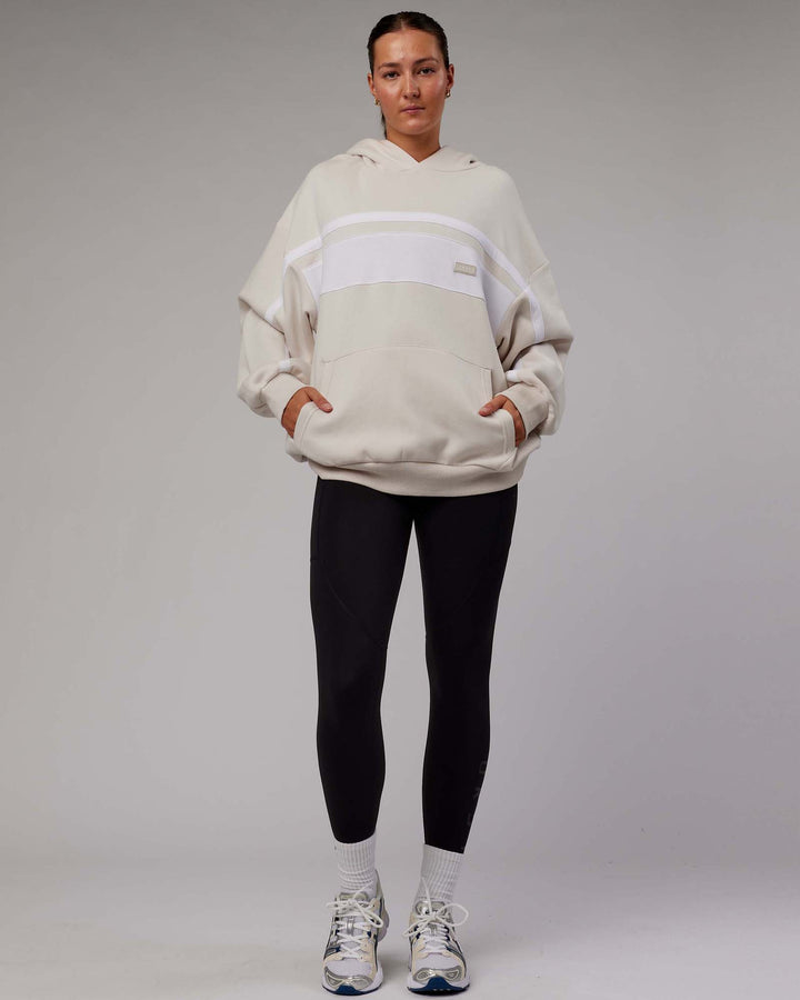 Woman wearing Unisex Intercept Hoodie Oversize - Clay-White