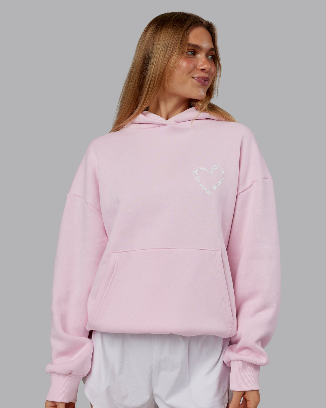 Woman wearing Unisex Love The Process Oversize Hoodie - Petal Pink-White | Model:Emilie | Size:XS