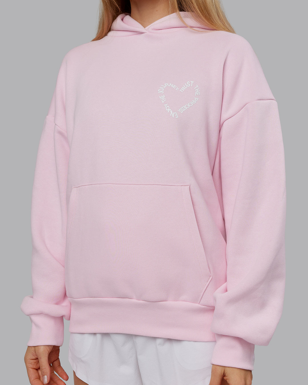 Woman wearing Unisex Love The Process Oversize Hoodie - Petal Pink-White | Model:Emilie | Size:XS