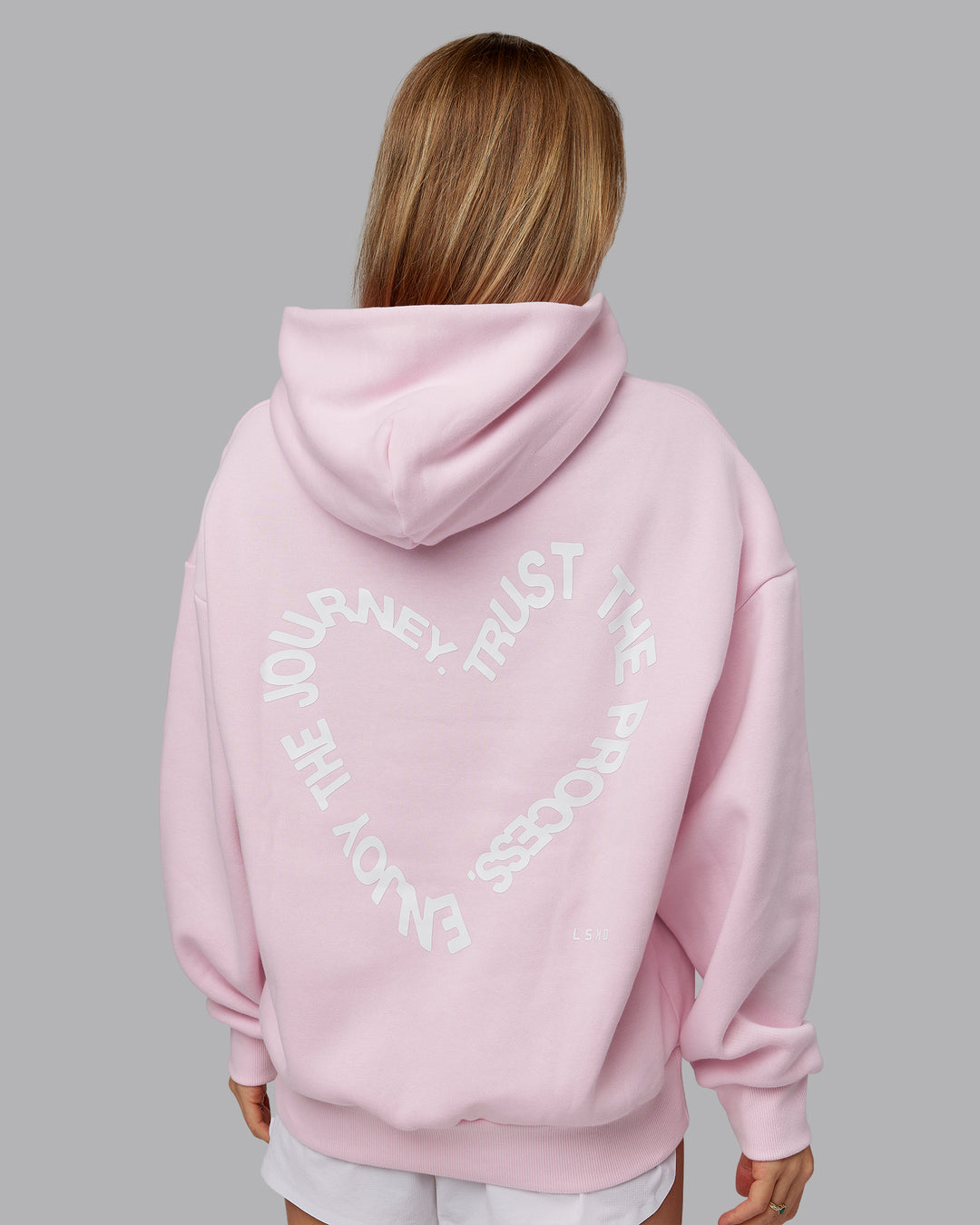 Woman wearing Unisex Love The Process Oversize Hoodie - Petal Pink-White | Model:Emilie | Size:XS