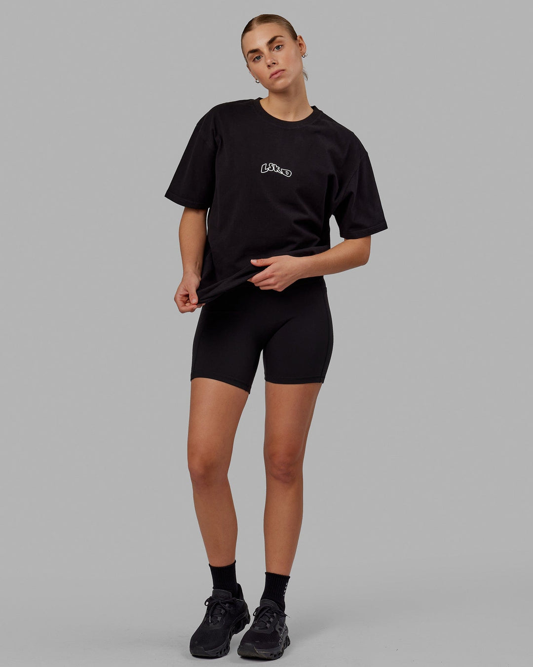 Woman wearing Unisex Mad Happy Heavyweight Tee Oversize - Black