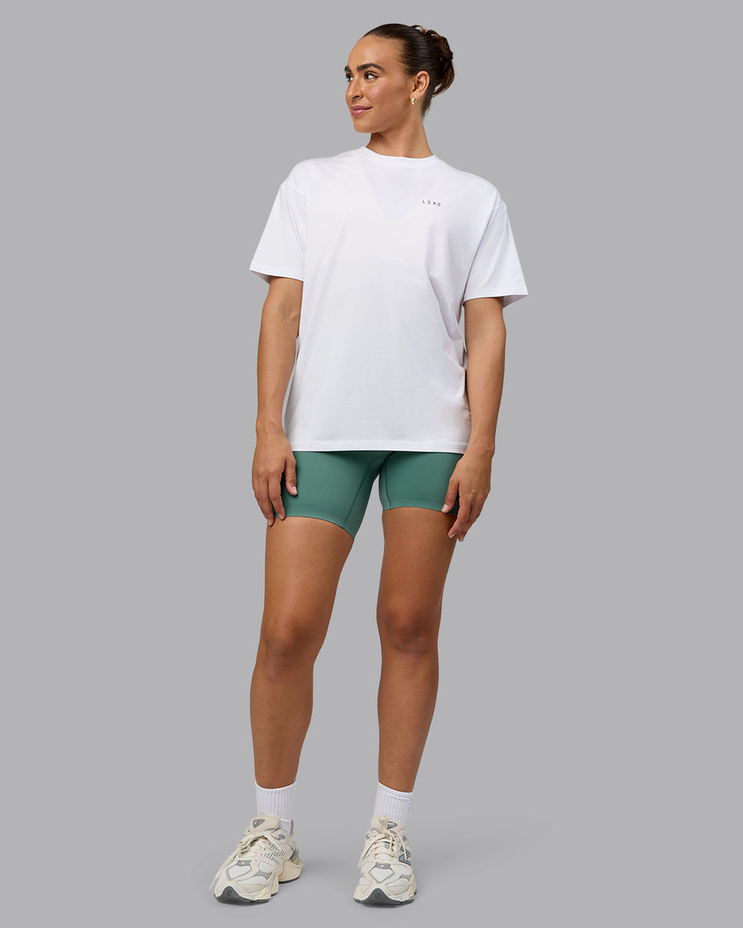 Woman wearing Unisex Move Fast Value Series FLXCotton Tee Oversize - White-Sagebrush