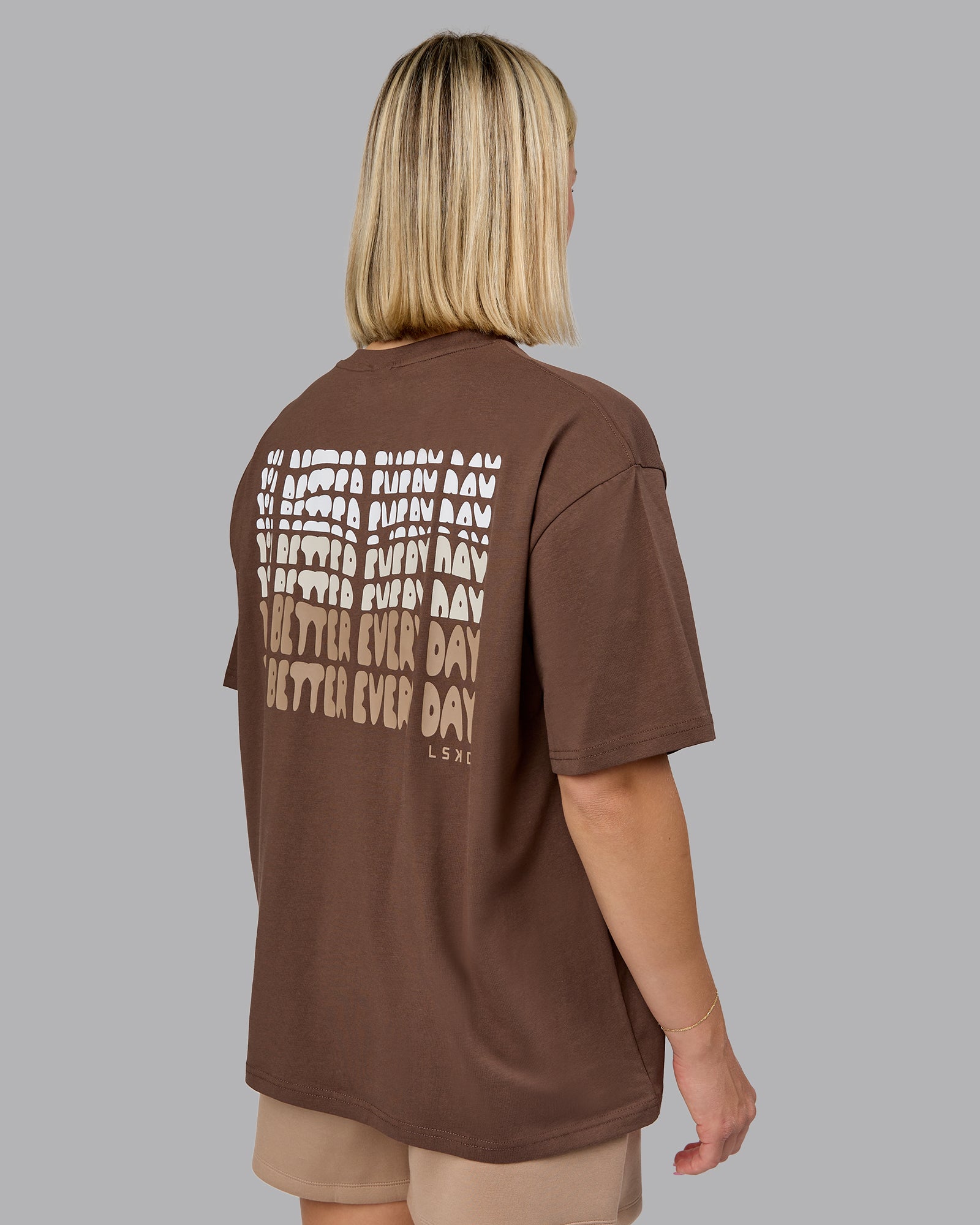 Woman wearing On Repeat FLXCotton Oversized Tee - Chocolate Martini-Taupe | Model:Halle | Size:S
