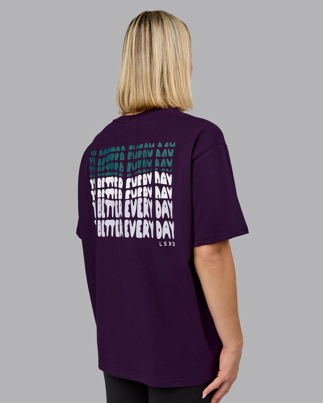 Woman wearing On Repeat FLXCotton Oversized Tee - Deep Purple-Lilac Smoke | Model:Halle | Size:S