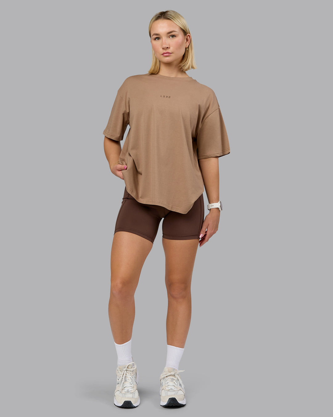 Woman wearing On Repeat FLXCotton Oversized Tee - Light Taupe-Choc | Model:Halle | Size:XS