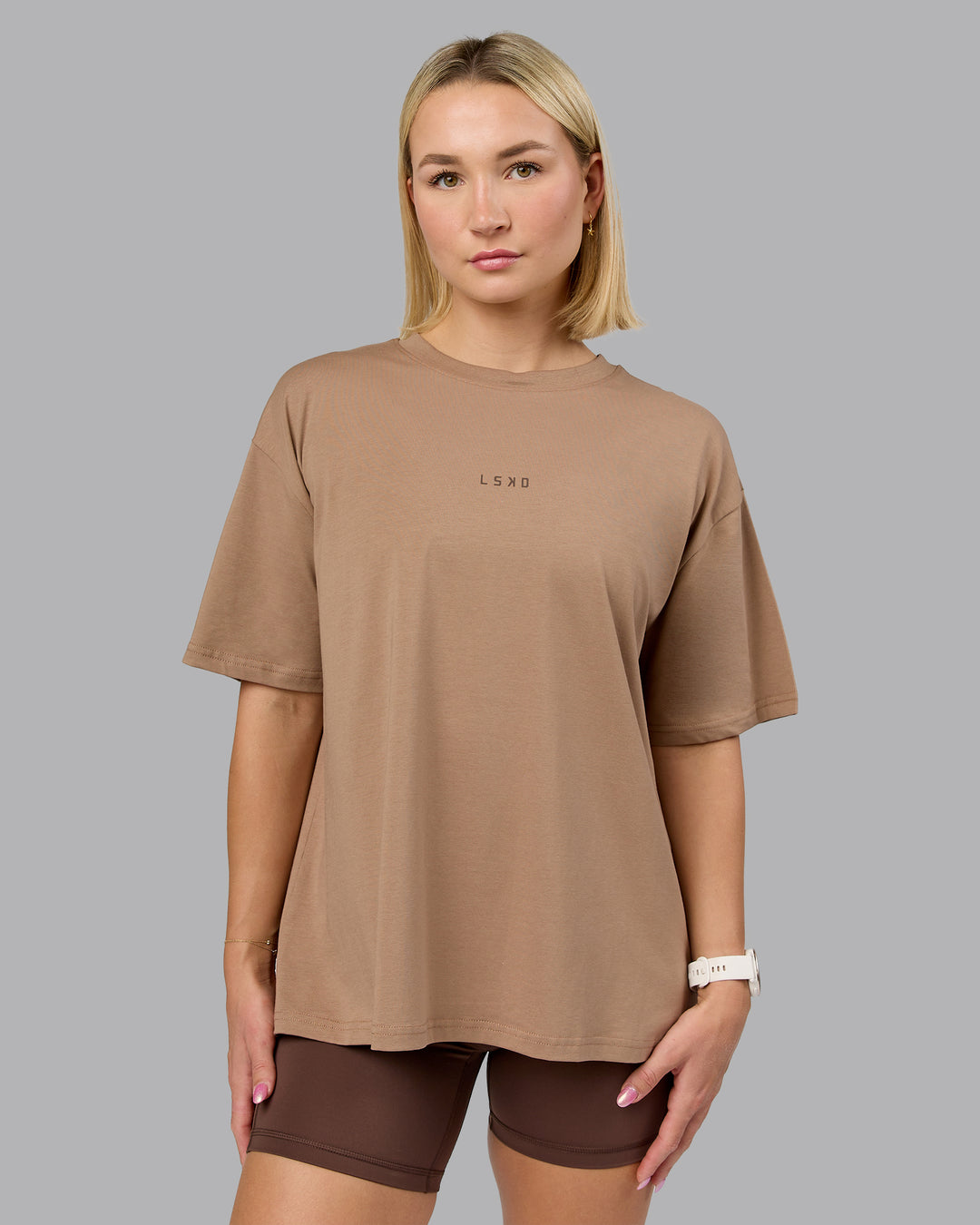 Woman wearing On Repeat FLXCotton Oversized Tee - Light Taupe-Choc | Model:Halle | Size:XS