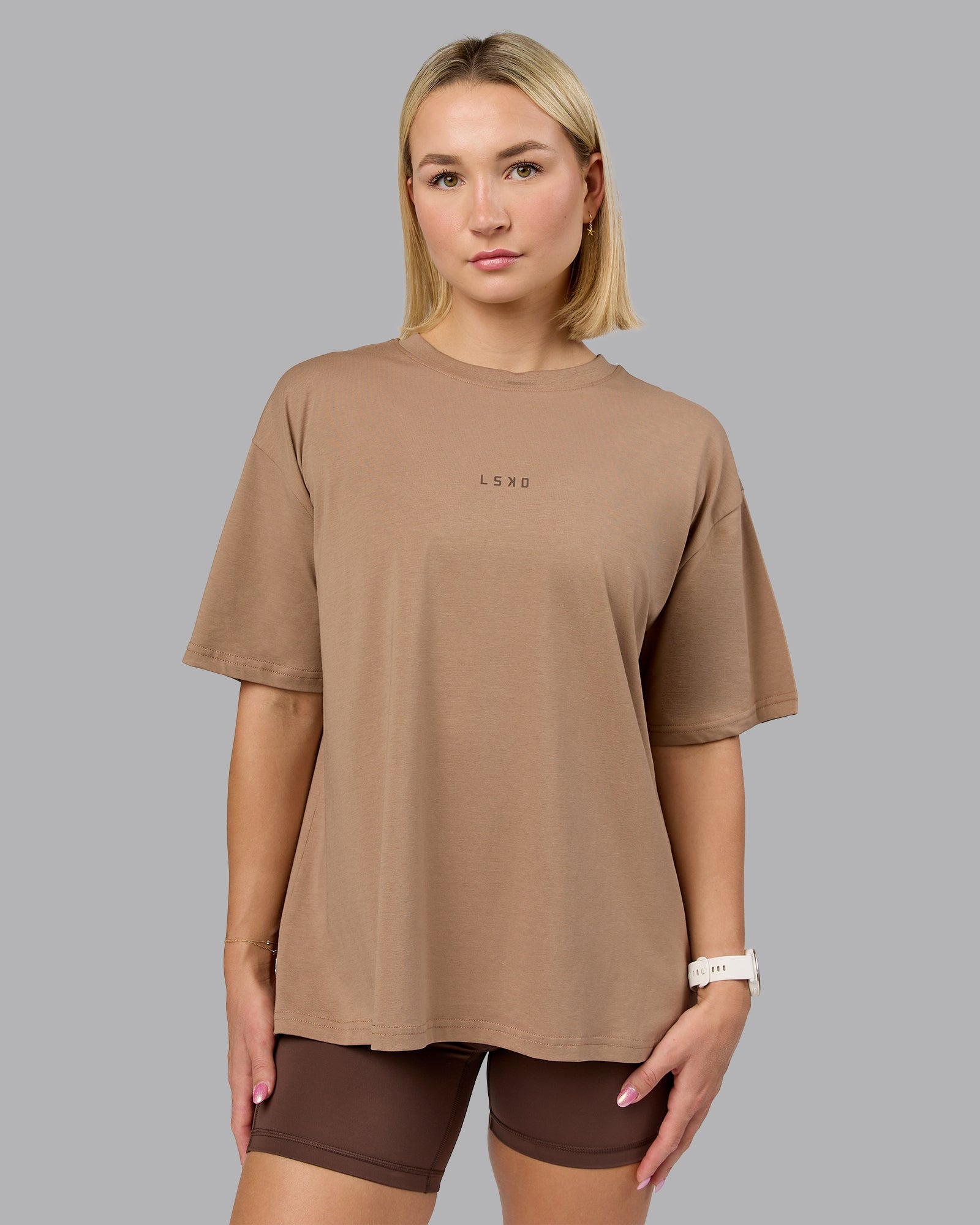 Woman wearing On Repeat FLXCotton Oversized Tee - Light Taupe-Choc | Model:Halle | Size:XS