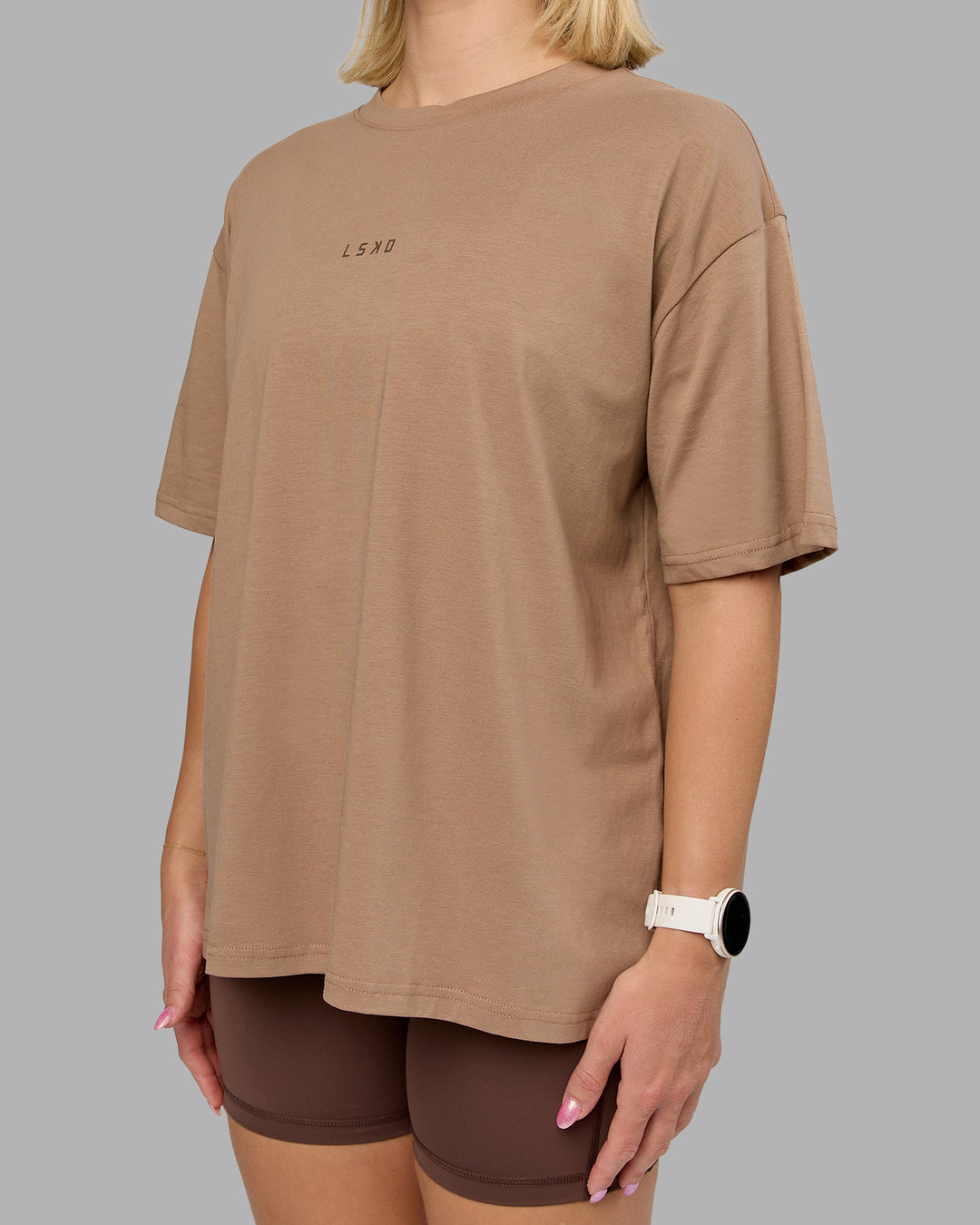 Woman wearing On Repeat FLXCotton Oversized Tee - Light Taupe-Choc | Model:Halle | Size:XS