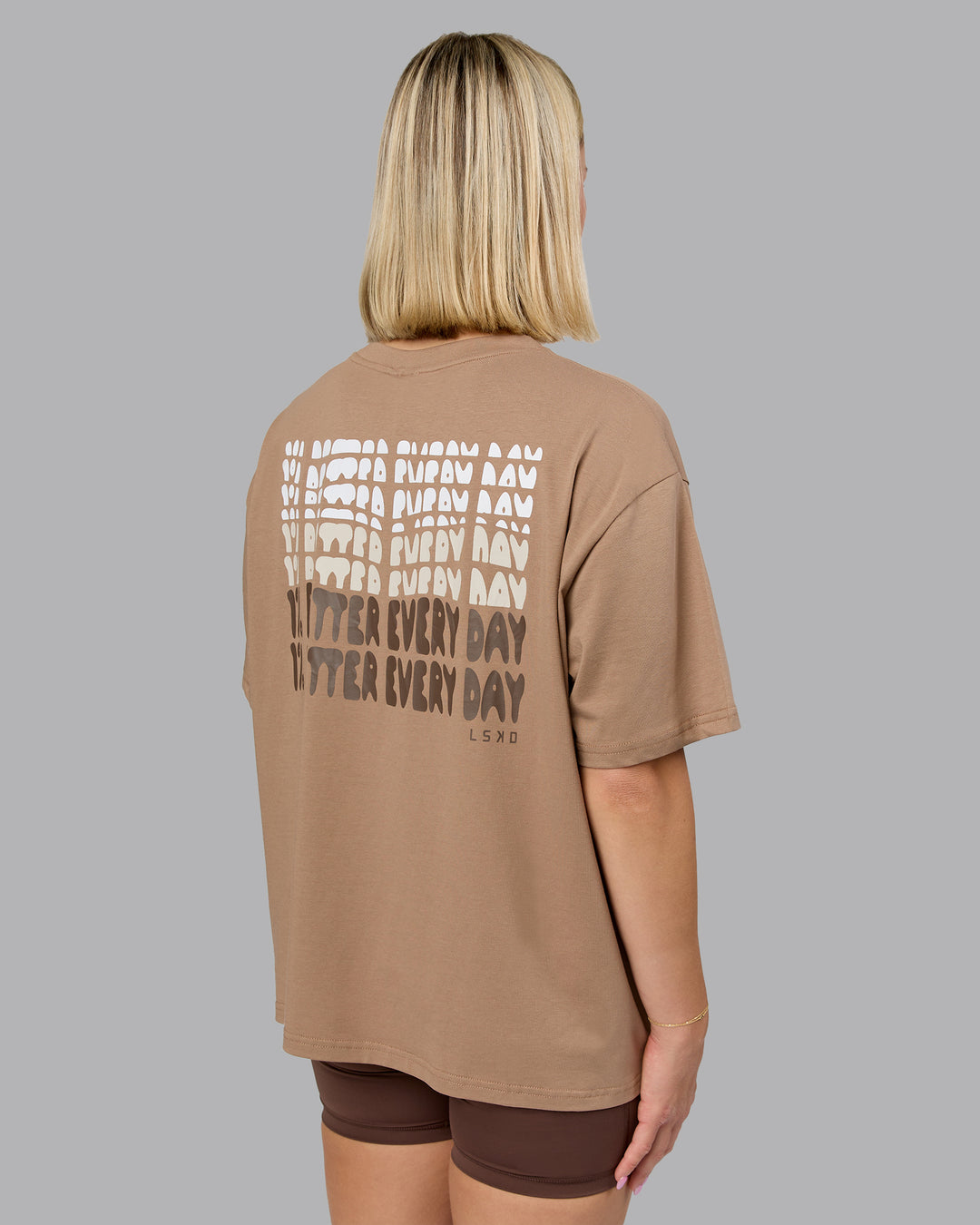 Woman wearing On Repeat FLXCotton Oversized Tee - Light Taupe-Choc | Model:Halle | Size:XS