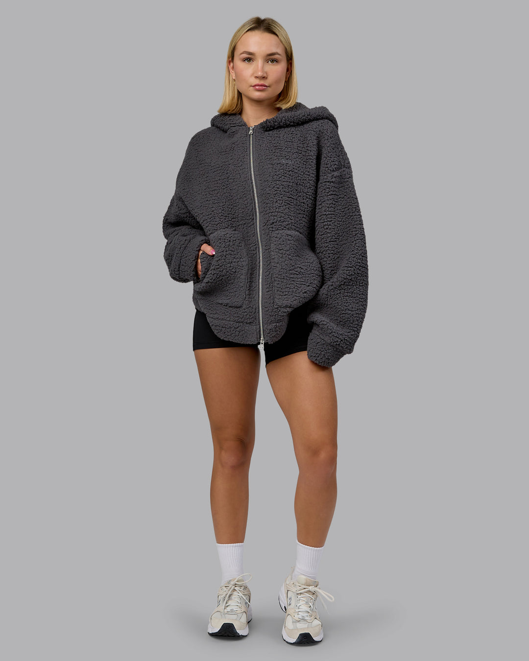 Woman wearing Sherpa Oversized Jacket - Dark Storm | Model:Halle | Size:XS