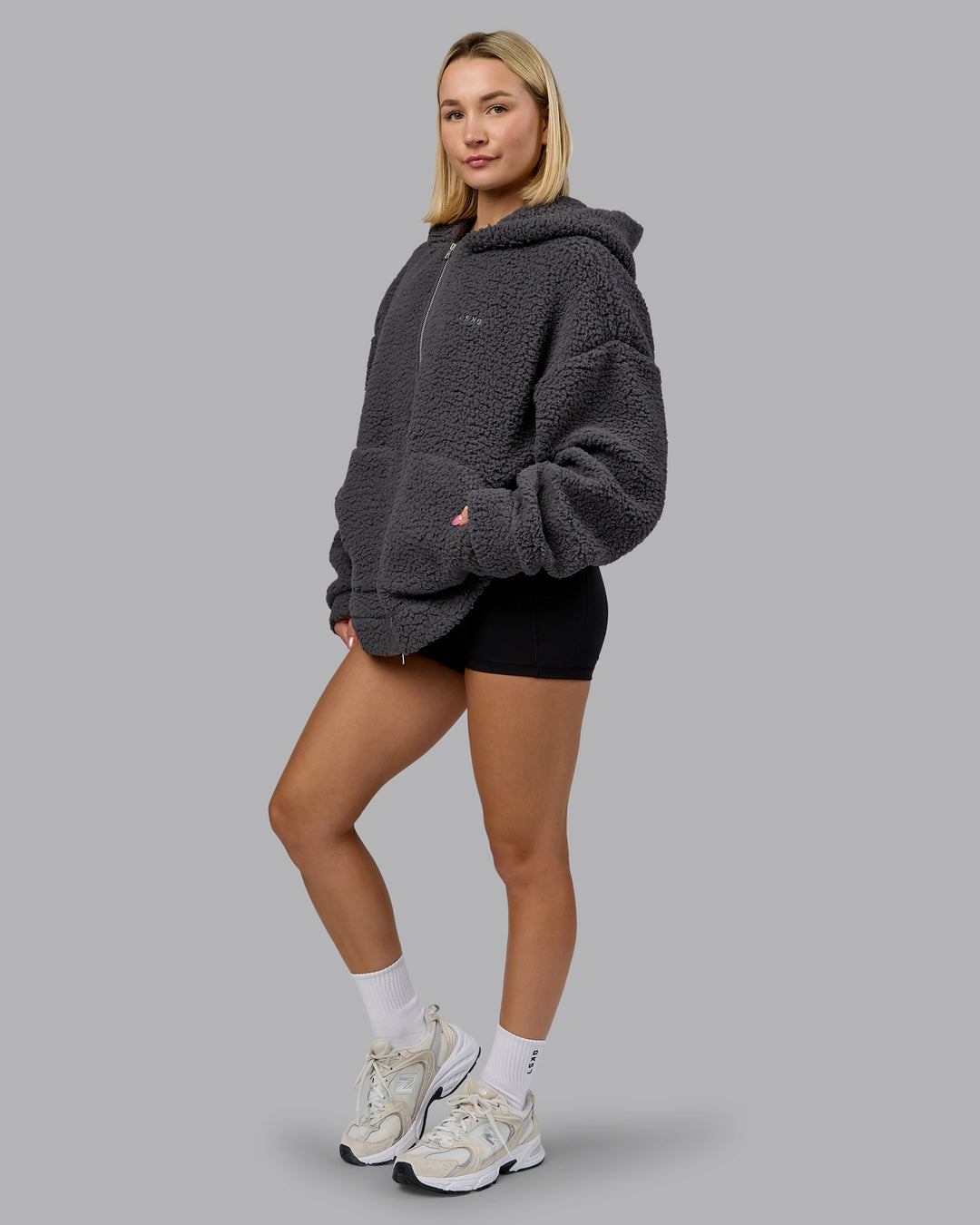 Woman wearing Sherpa Oversized Jacket - Dark Storm | Model:Halle | Size:XS