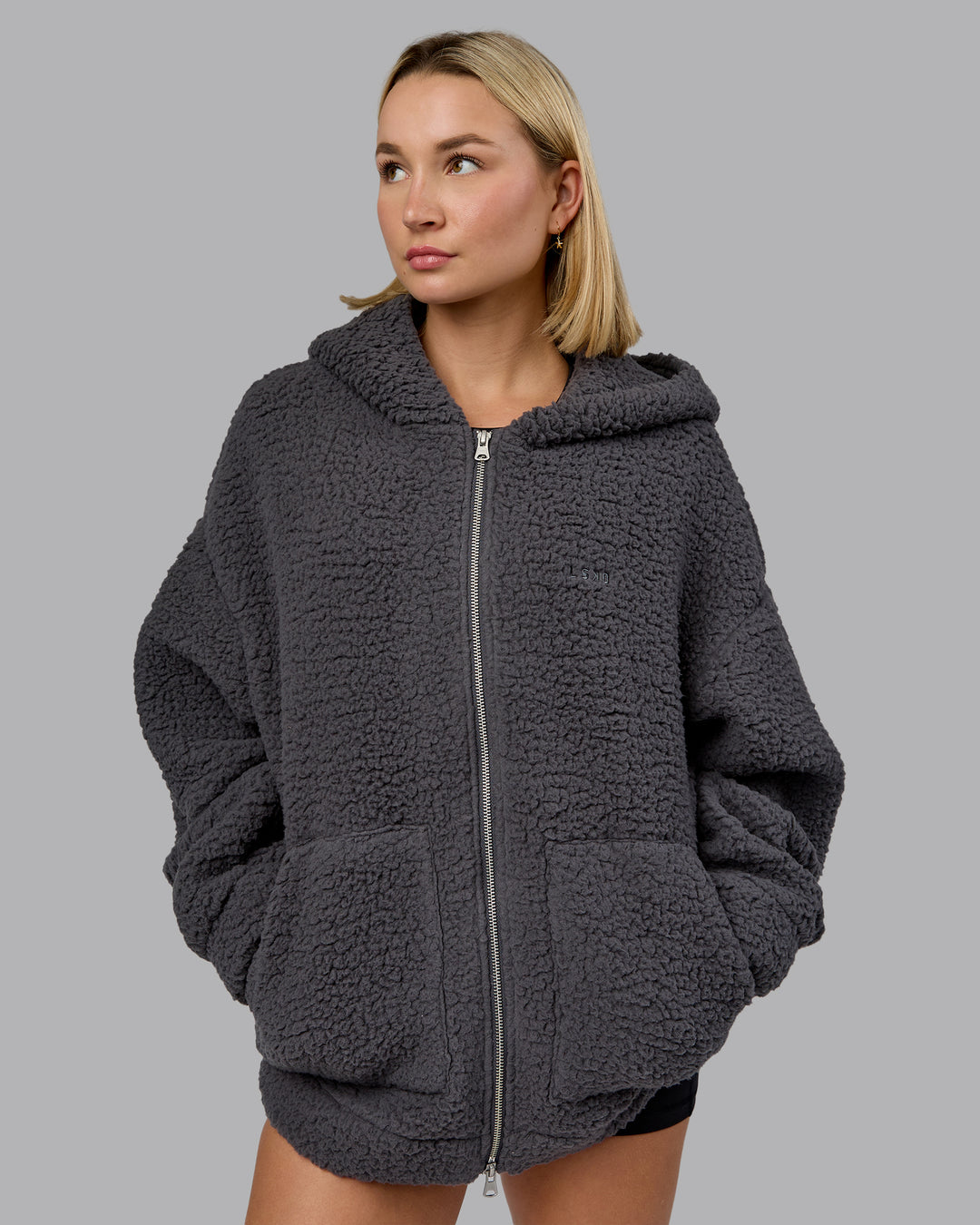 Woman wearing Sherpa Oversized Jacket - Dark Storm | Model:Halle | Size:XS