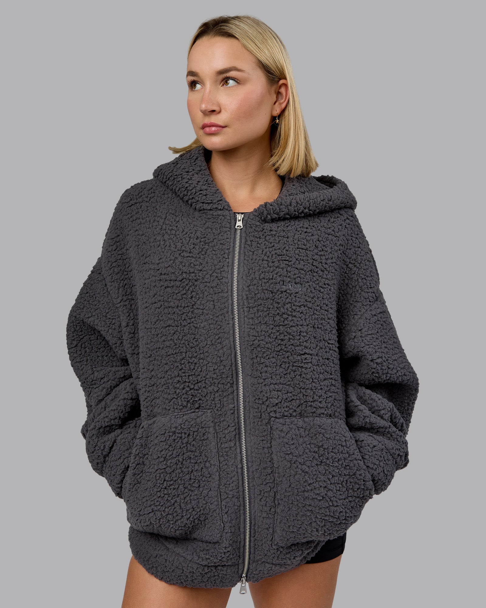 Woman wearing Sherpa Oversized Jacket - Dark Storm | Model:Halle | Size:XS