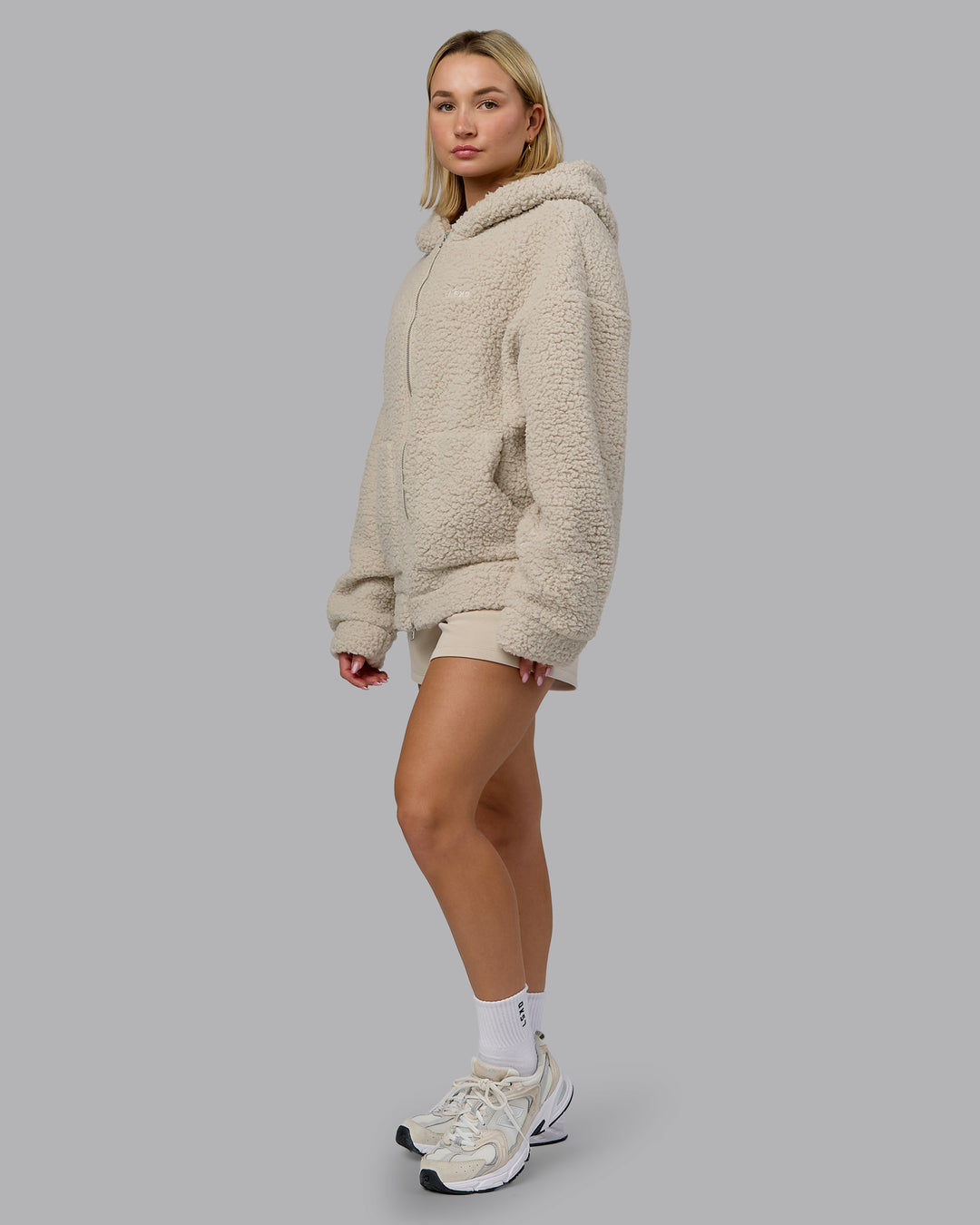 Woman wearing Sherpa Oversized Jacket - Shale Beige | Model:Halle | Size:XS
