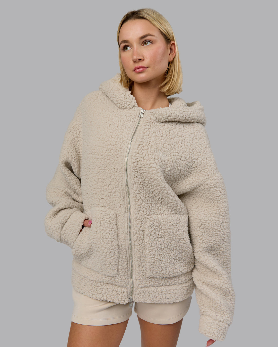 Woman wearing Sherpa Oversized Jacket - Shale Beige | Model:Halle | Size:XS