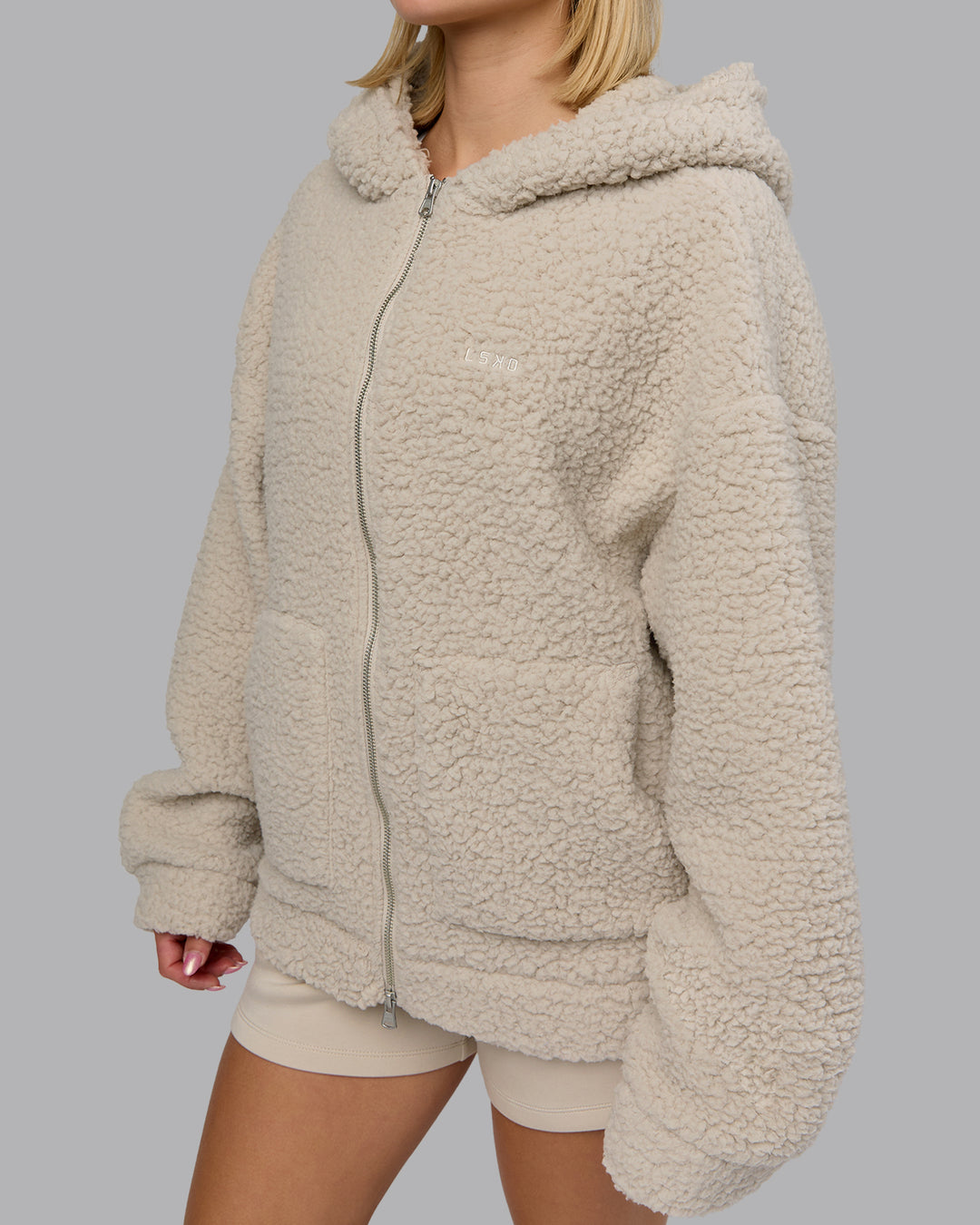 Woman wearing Sherpa Oversized Jacket - Shale Beige | Model:Halle | Size:XS