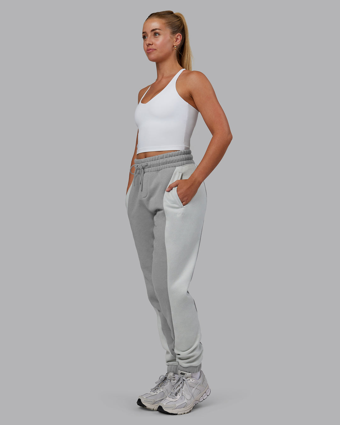 Woman wearing Stream Panel Track Pants - Circular Grey-Digital Mist | Model:Hannah | Size:XS
