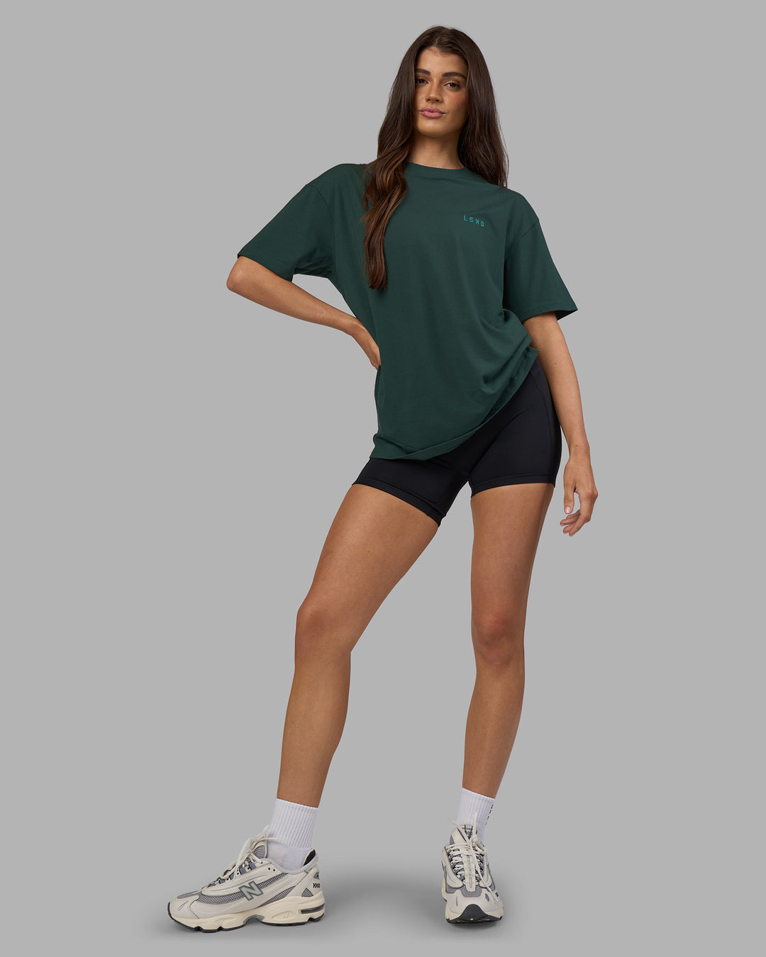 Woman wearing Unisex Strike Through FLXCotton Tee Oversize - Vital Green-Alexandrite | Model:Phoebe | Size:XS