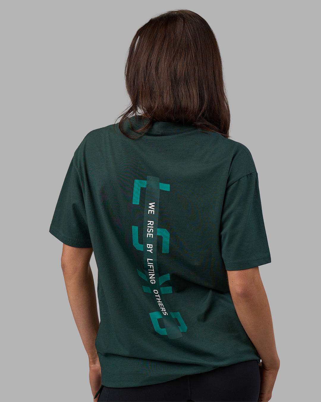 Woman wearing Unisex Strike Through FLXCotton Tee Oversize - Vital Green-Alexandrite | Model:Phoebe | Size:XS