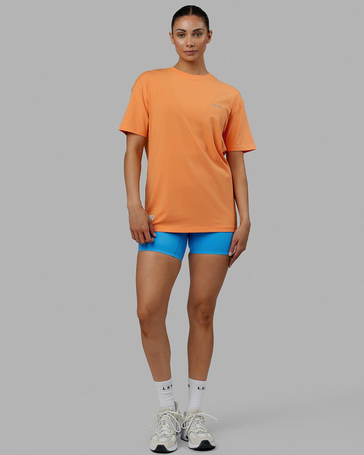 Woman wearing Unisex VS6 FLXCotton Tee Oversize - Tangerine-Azure Blue
