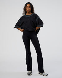 Woman wearing Urban Blur Heavyweight Unisex Oversized Tee - Black-Dark Storm | Model:Jordan | Size:S