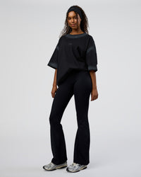 Woman wearing Urban Blur Heavyweight Unisex Oversized Tee - Black-Dark Storm | Model:Jordan | Size:S