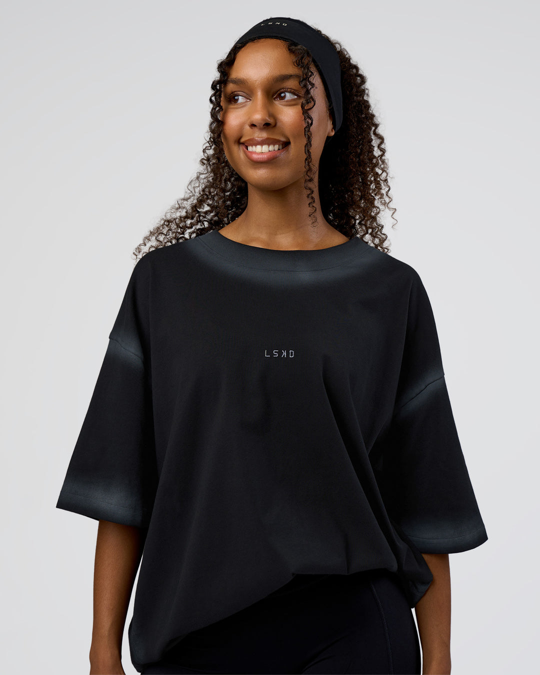 Woman wearing Urban Blur Heavyweight Unisex Oversized Tee - Black-Dark Storm | Model:Jordan | Size:S