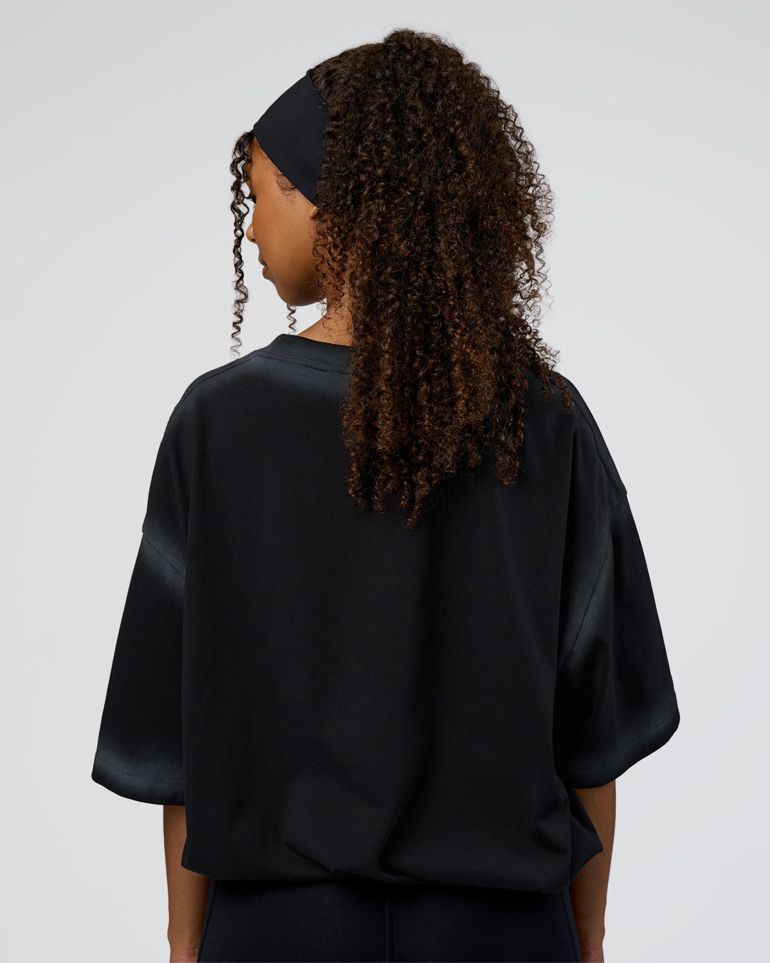 Woman wearing Urban Blur Heavyweight Unisex Oversized Tee - Black-Dark Storm | Model:Jordan | Size:S