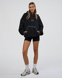 Woman wearing Urban Blur Unisex Oversized Hoodie - Black-Dark Storm | Model:Leilani | Size:XS