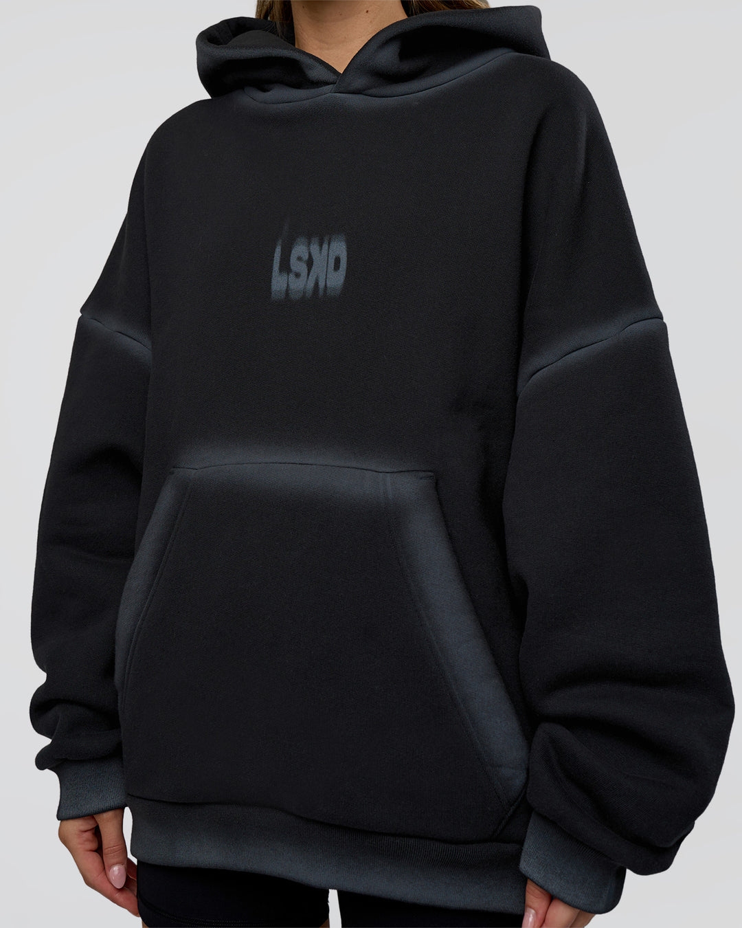 Woman wearing Urban Blur Unisex Oversized Hoodie - Black-Dark Storm | Model:Leilani | Size:XS
